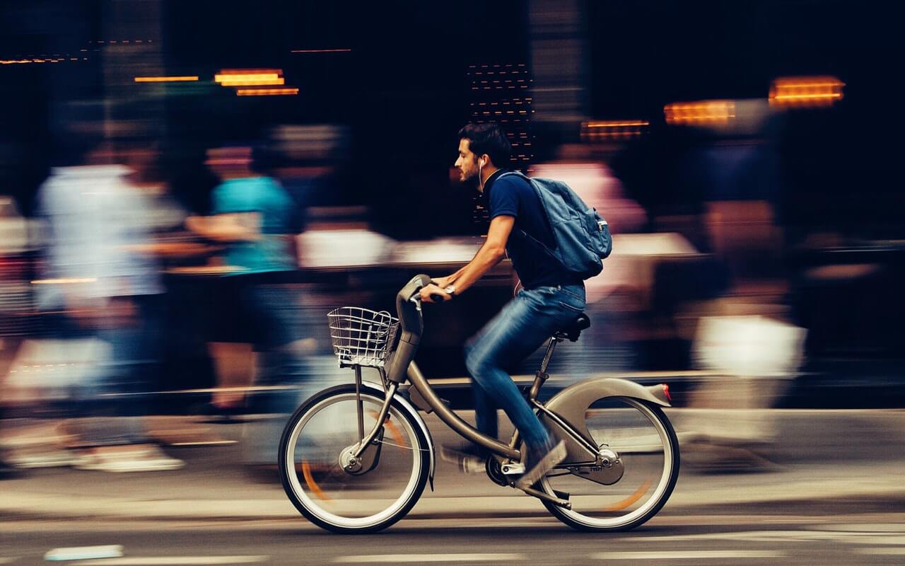 Quam quisque id diam vel quam elementum Man Riding Bicycle On City Street 310983